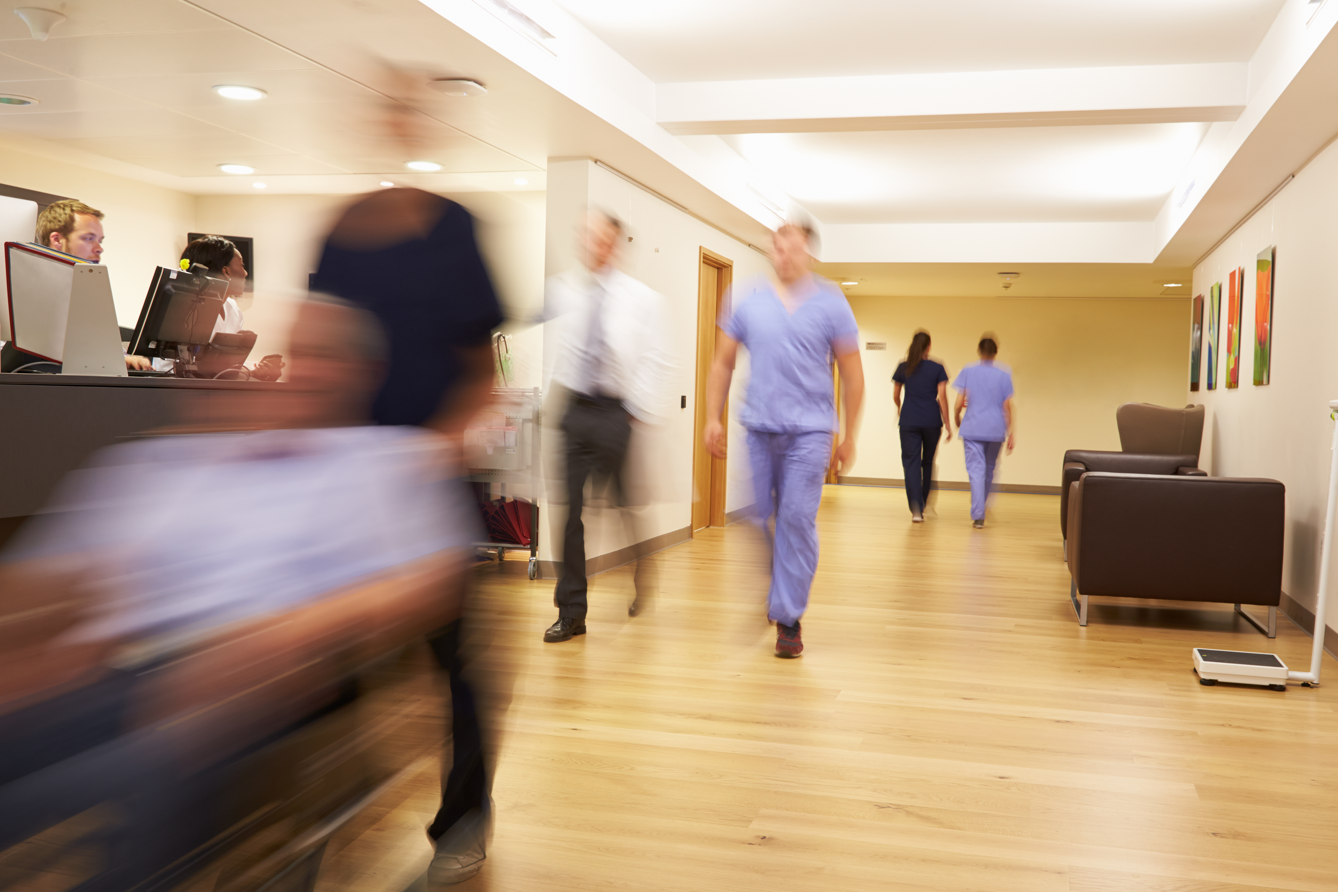 nurses-station-people-walking nurses-station-people-walking